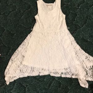 White lace dress with handkerchief hem